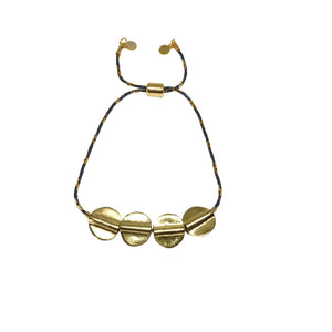 Adjustable bracelet with small gold discs